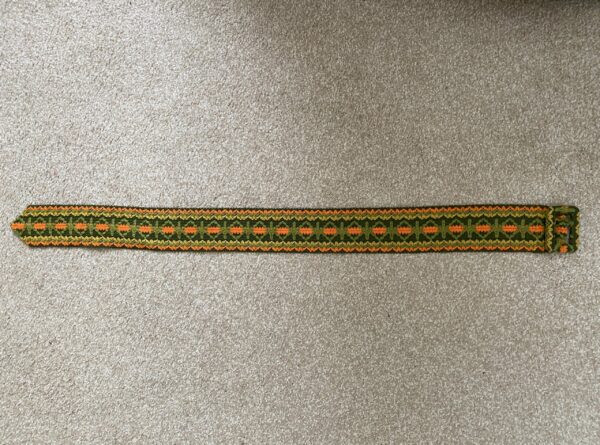 vintage green, yellow, and orange belt
