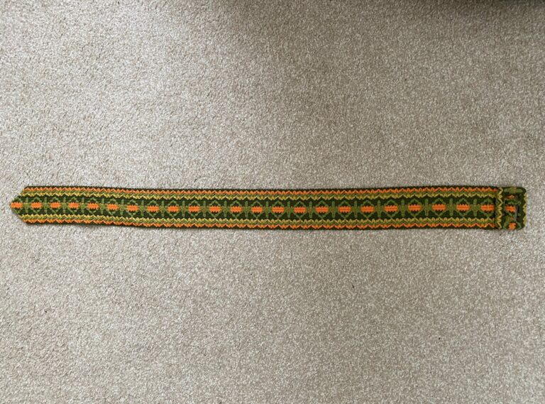 vintage green, yellow, and orange belt