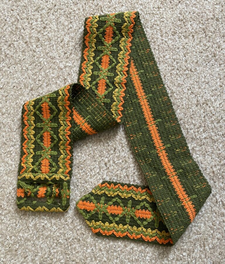 vintage green, yellow, and orange belt