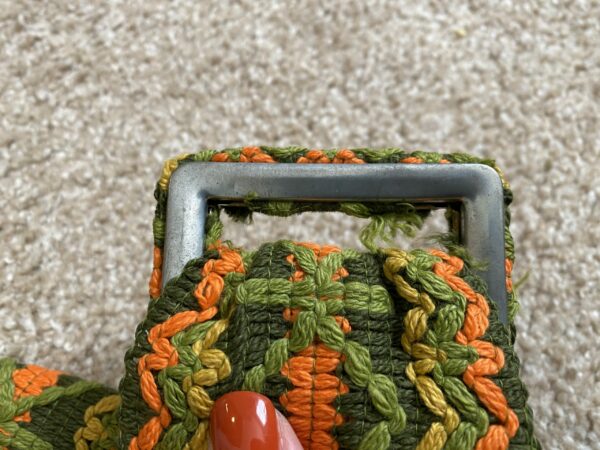 vintage green, yellow, and orange belt