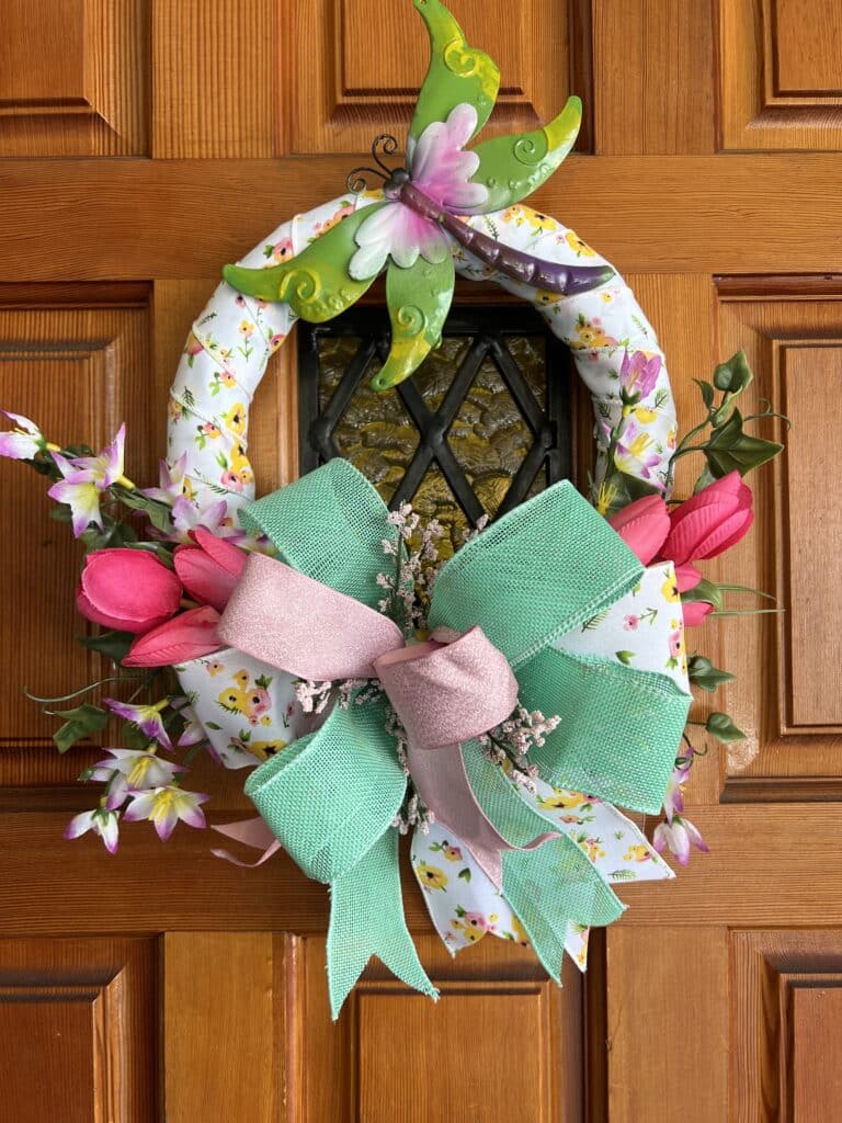 ribbon wrapped dragonfly wreath with florals