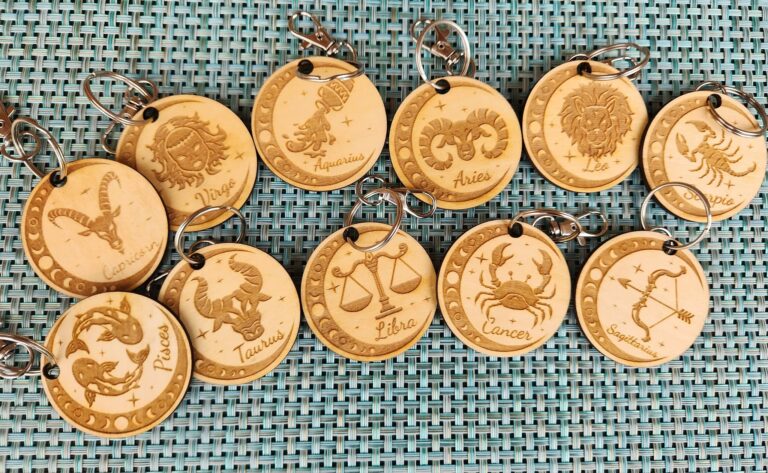 Engraved wood Zodiac keychains.