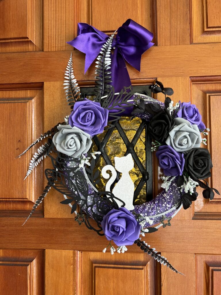purple black gray round wreath with white cat sillhouette
