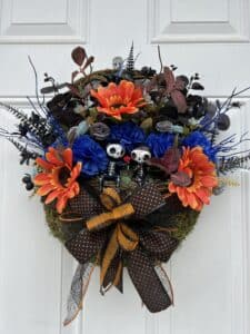 floral basket with skeleton couple