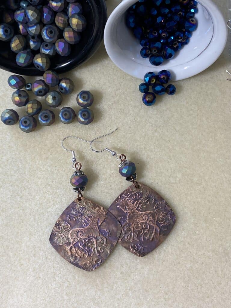 pink & purple horse stamped metal earrings