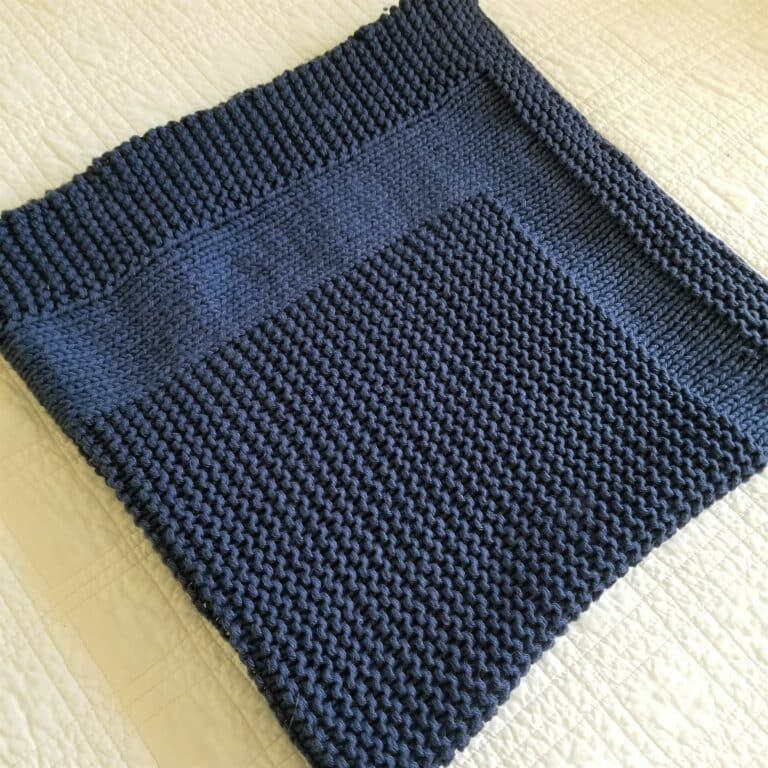 Sample of Picture Rock baby blanket knitting pattern knit with navy yarn.