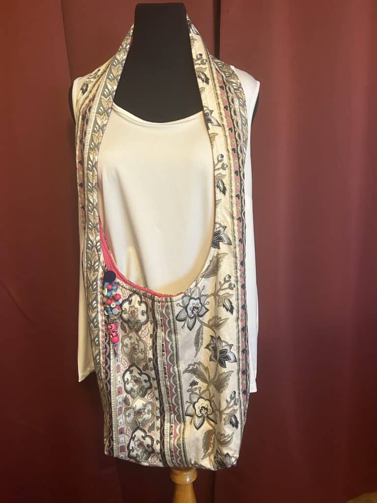 Boho style purse can be worn over the shoulder for comfort and style. Made of durable upholstery fabric.