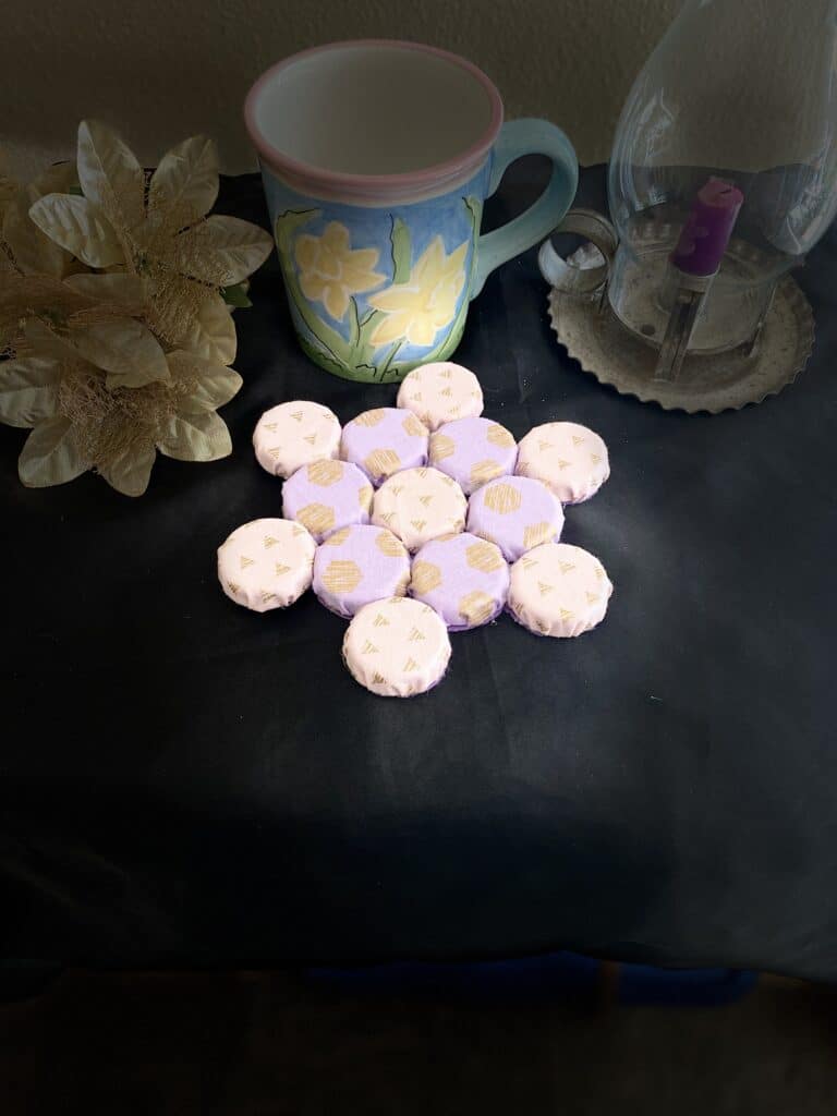 This beautiful handmade pink and purple trivet is a practical and stylish addition to any kitchen