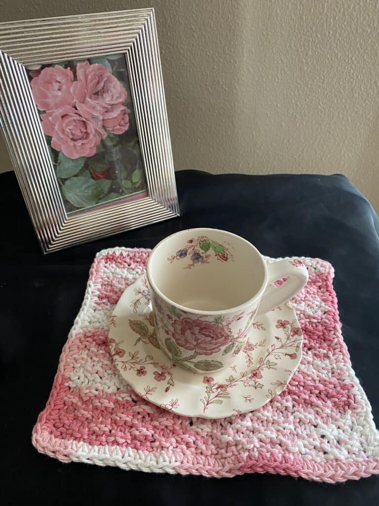 A beautiful handmade pink and white knitted/crochet dish rag that is both functional and stylish (Free shipping)