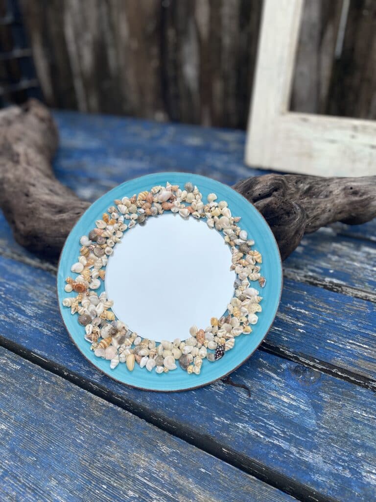 This beautiful plate is designed with a stunning blend of green and blue hues embedded with intricate shells.