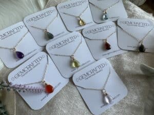 A picture of the packaged necklaces showing more available color options.