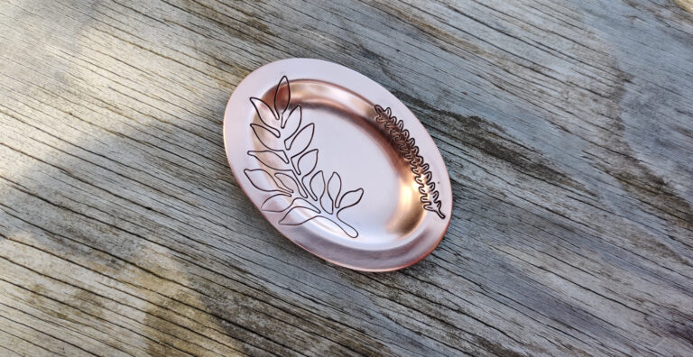 Copper trinket dish embossed with deeep botanical patterns