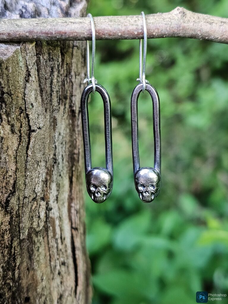 Silver skull dangle earrings
