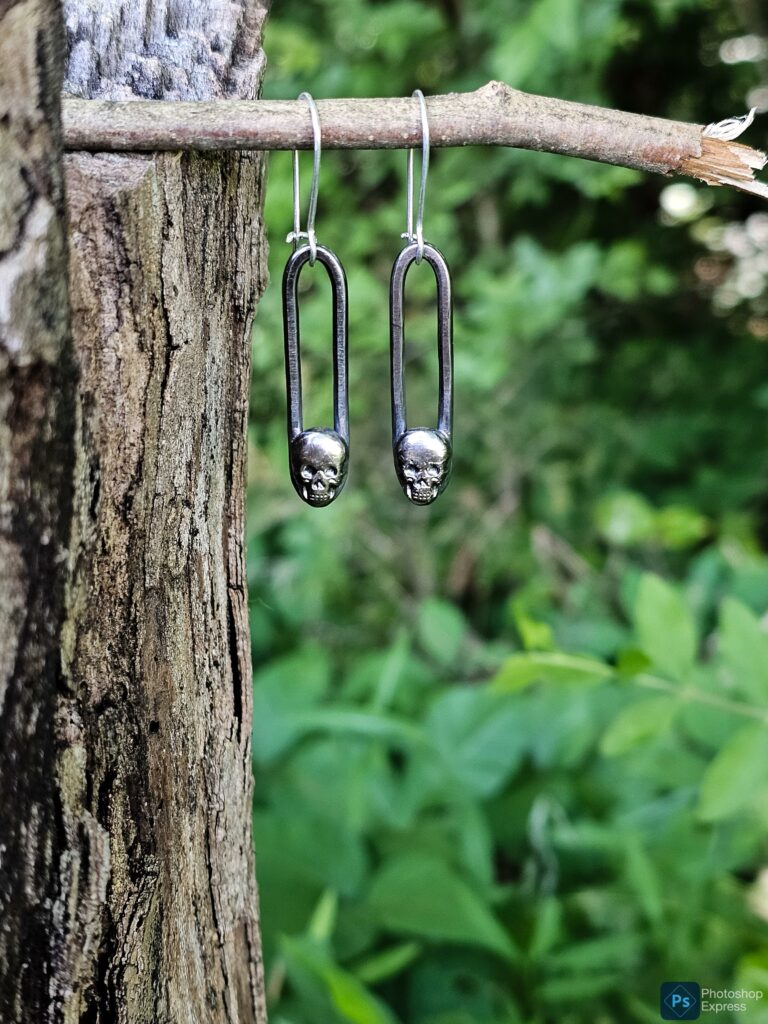 Silver skull dangle earrings