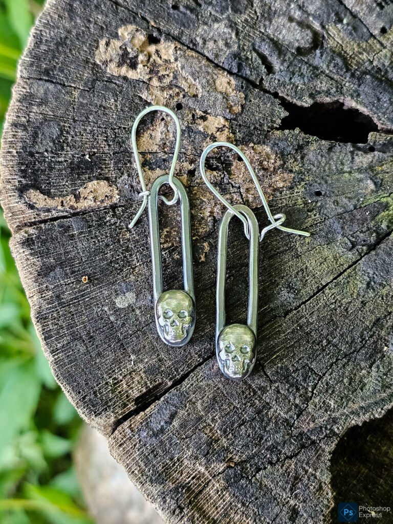 Silver skull dangle earrings