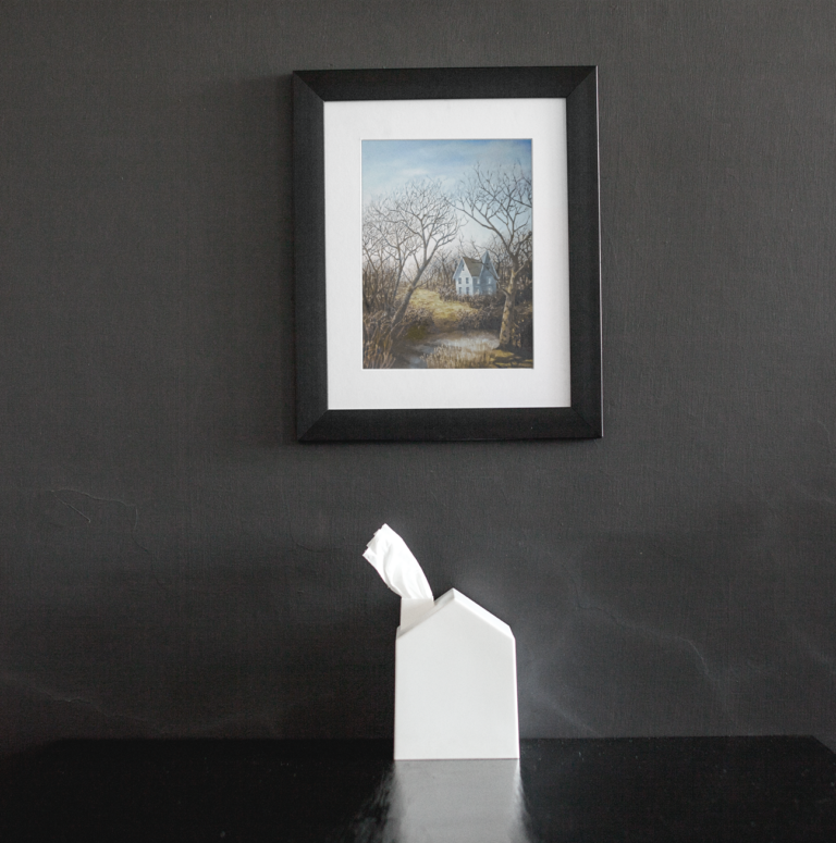 framed art print mockup on a black wall over a black table a14688 1