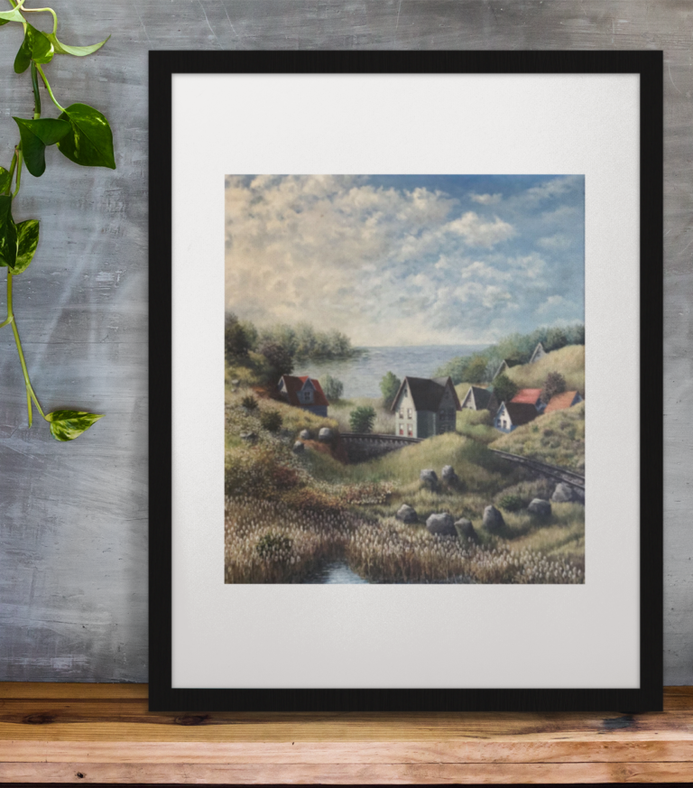framed art print standing on a wooden desk against a concrete wall near a hand decoration a10403 1