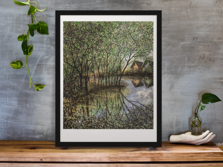 framed art print standing on a wooden desk against a concrete wall near a hand decoration a10403 two houses reflected