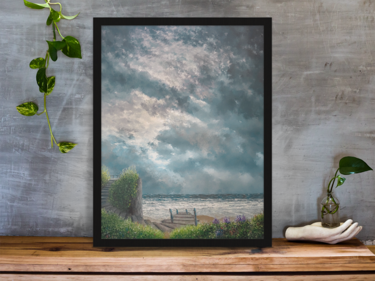 framed art print standing on a wooden desk against a concrete wall near a hand decoration a10403 9