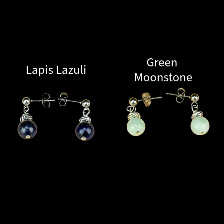 Two pair of Hypoallergenic Earrings One pair has blue 8mm stones and the other pair has pale green 8mm stones. Both pair have silver posts.