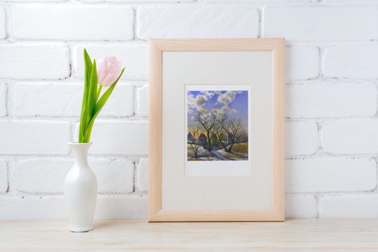 mockup of a framed art print placed next to a flower vase 37134 r el2