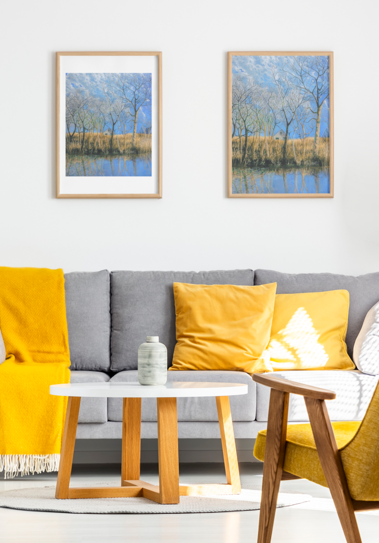mockup of two art prints hanging over a comfy couch 36094 r el2