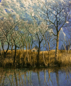 Calm river with reflections of leafless trees. River bank with Winter grasses, extending further inland partially hides the two house in the near background. Sky of vertical moving clouds.