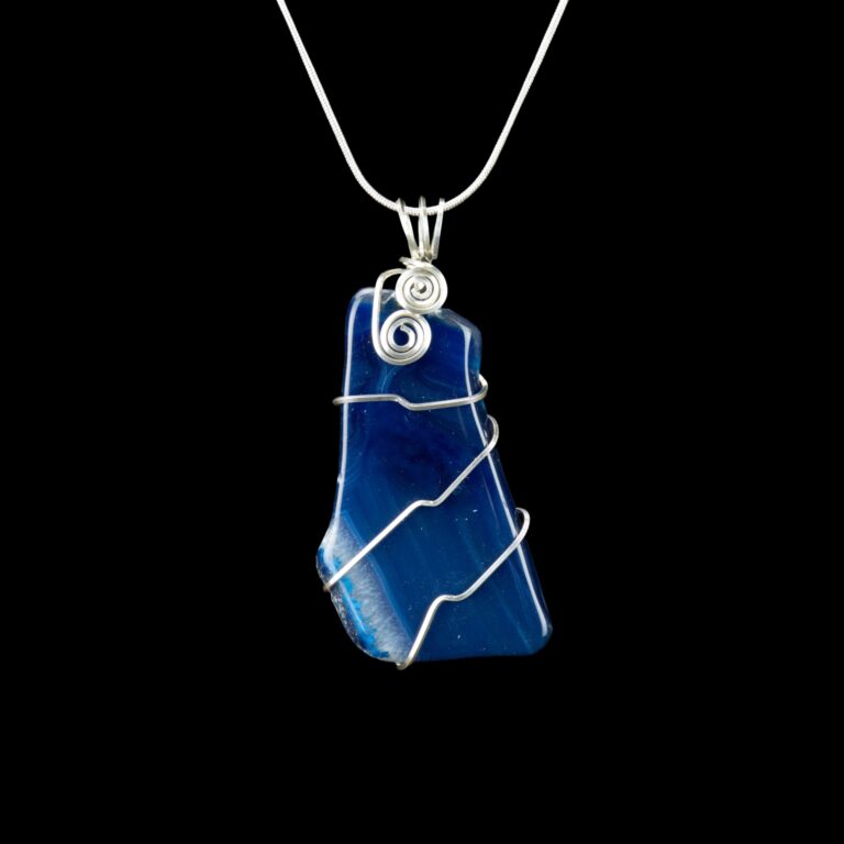 Blue agate pendant wrapped minimally in square Argentium Silver wire and hanging from a silver chain.