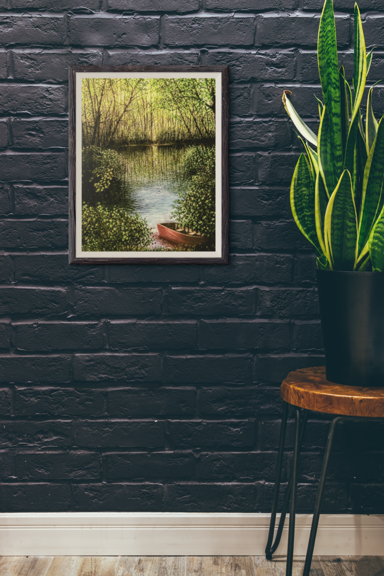 mockup featuring an art print hanging next to a plant 3918 el1