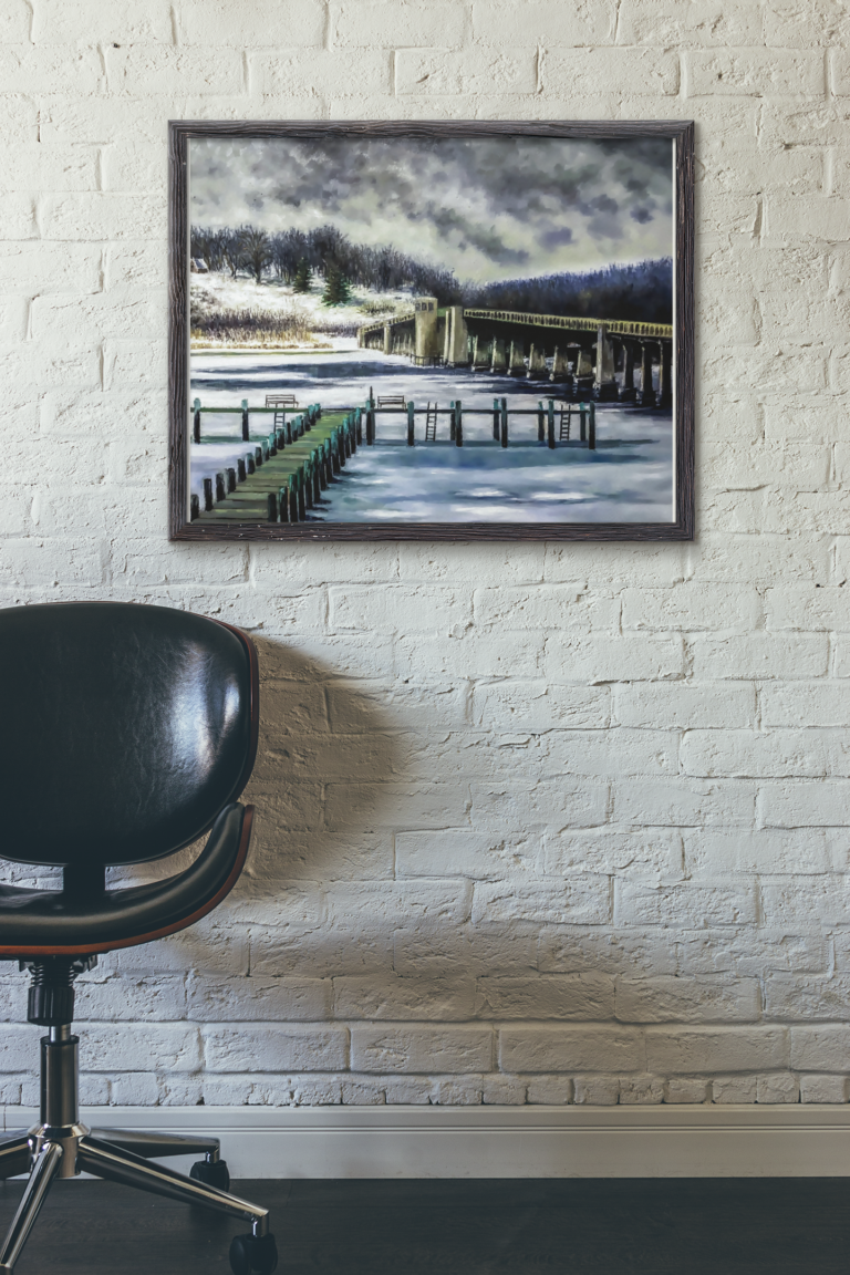 mockup of a framed art print hanging near a leather chair 4878 el1