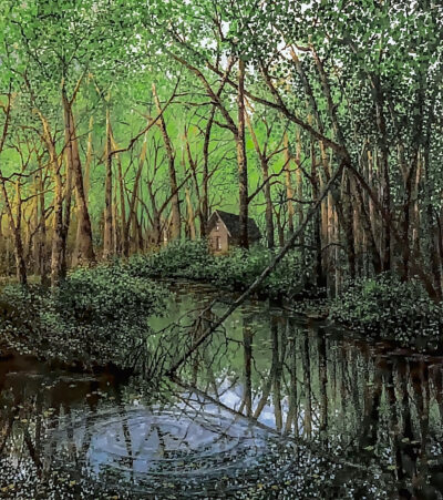 The foreground is a lake with reflections of the surrounding forest. Lake has a large, rounded ripple in the foreground. There is a shed on right side of the bank.