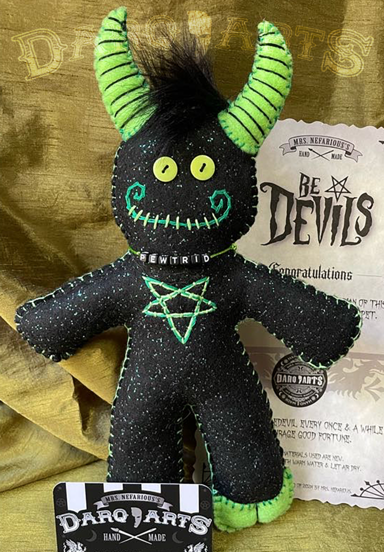 Bedevils. Name Pewtrid. Sparkle black felt body with bright green accents. Front view.