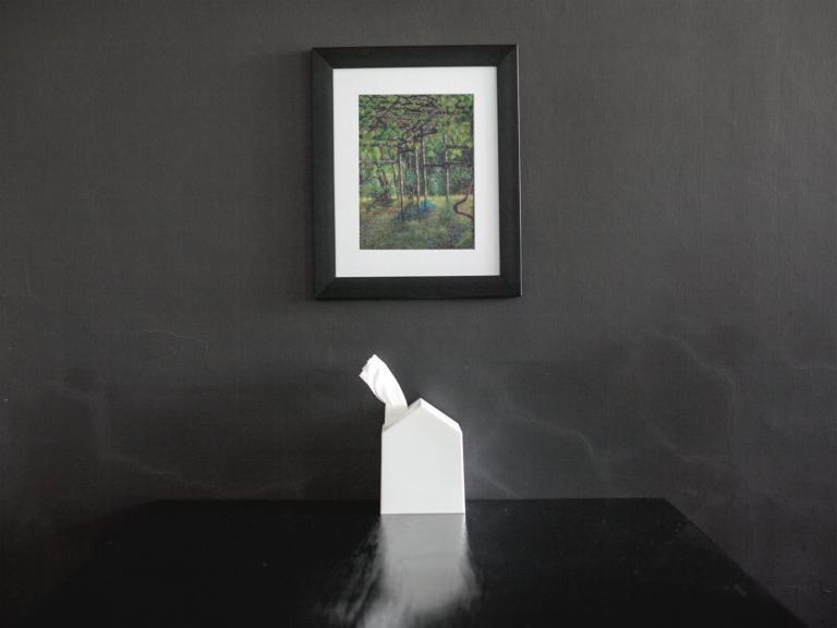 framed art print mockup on a black wall over a black table a14688 1