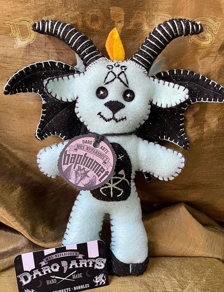 Baphomet front full view of adorable soft felt poppet handmade by Mrs. Nefarious of Darq.arts. Sparkle white body with black wings, horns, hooves and tummy. Eternal flame on top of head.