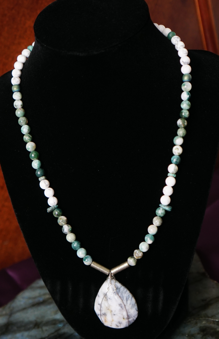 Moss agate stone necklace on neck form