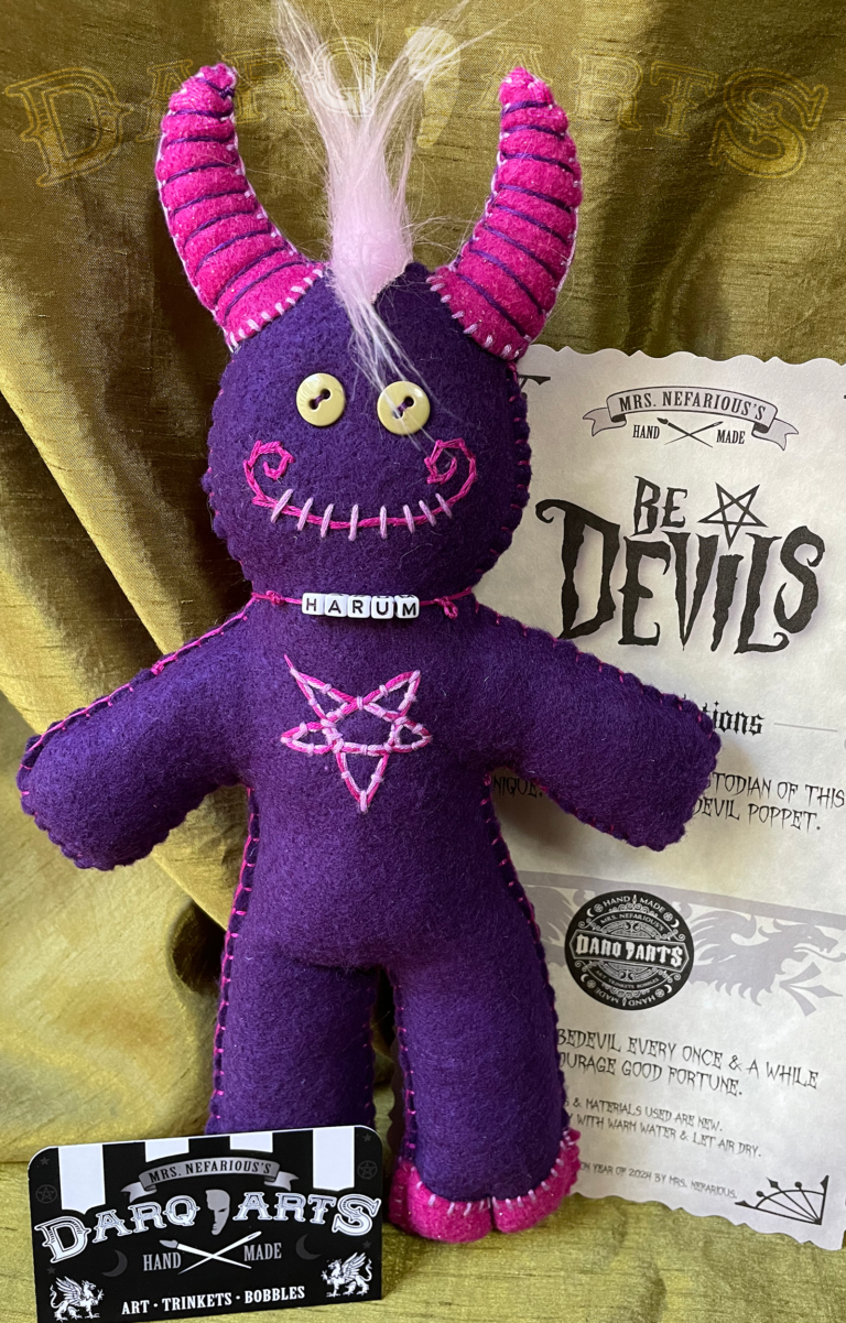 Bedevils. Name Harum. Purple soft felt body with hot pink accents. Front view.