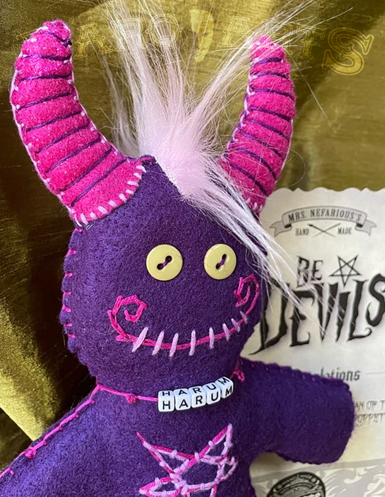 Bedevils. My name is Harum. I have a purple felt body with hot pink accents.