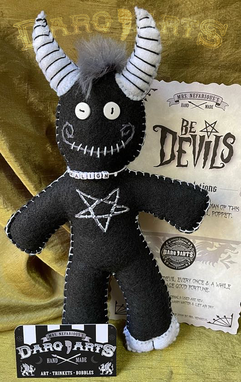 Bedevils. Name Malign. Black soft felt body with white accents. Full front view.
