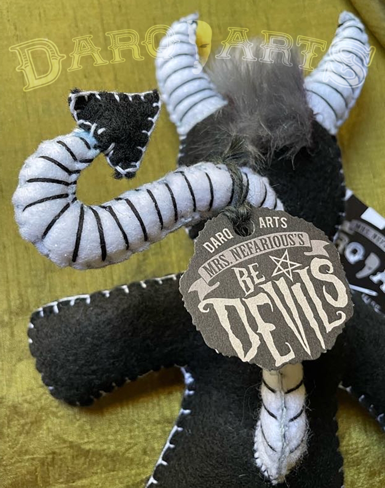 Bedevils - Malign. Black soft felt body with white horns, tail, hooves and reversed pentagram. Close up back view.