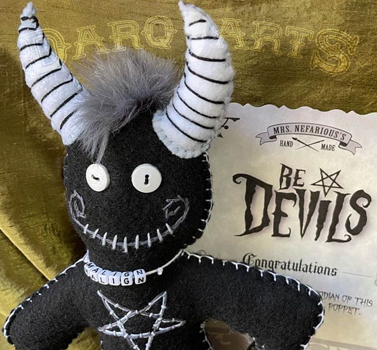 Bedevils - Malign. Black soft felt body with white horns, tail, hooves and reversed pentagram. Close up back view.