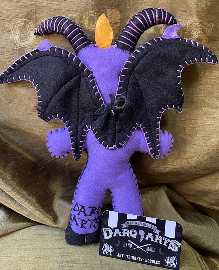 Baphomet back full view of adorable soft felt poppet handmade by Mrs. Nefarious of Darq.arts. Purple body with black wings, horns, hooves and tummy. Eternal flame on top of head.
