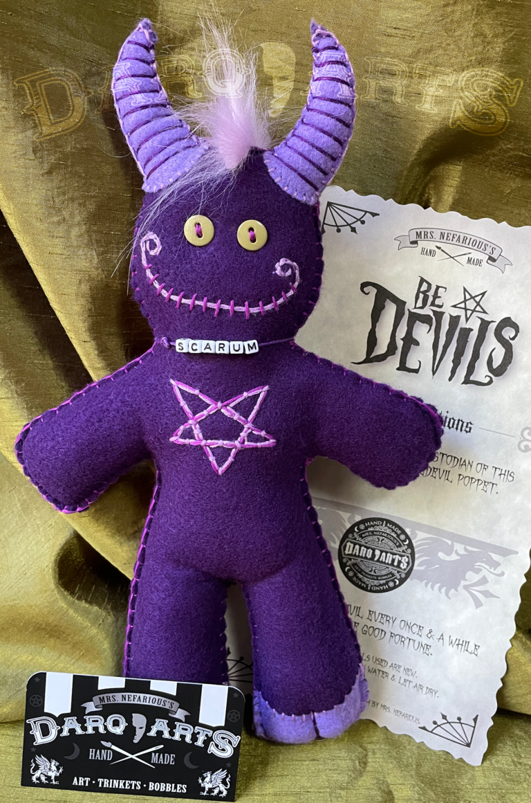 Bedevils. Name Scarum. Purple soft felt body with lavender accents. Full front view.