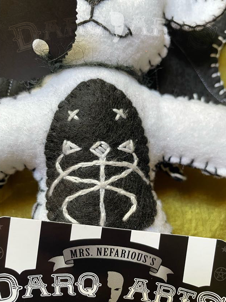 Baphomet Sparkle white. Front view close up of hand stitched snake emblem on tummy.