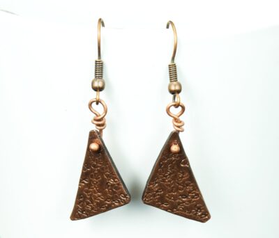 Stamped copper triangle dangle earrings.