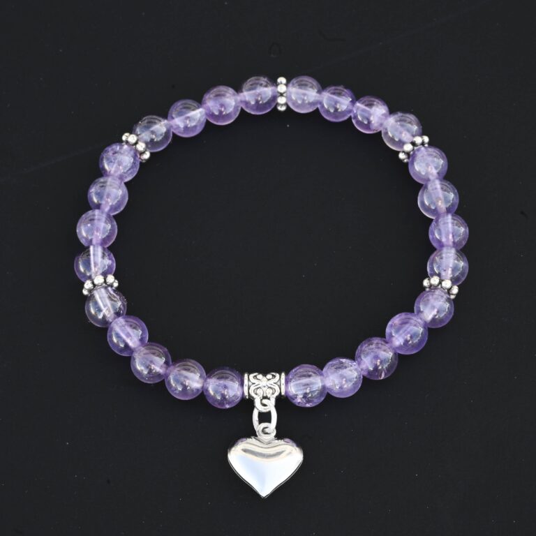 6mm purple amethyst bead bracelet with a silver puffy heart charm. This is a stretch bracelet and it has silver daisy spacers distributed throughout the bracelet. It is on a black background.