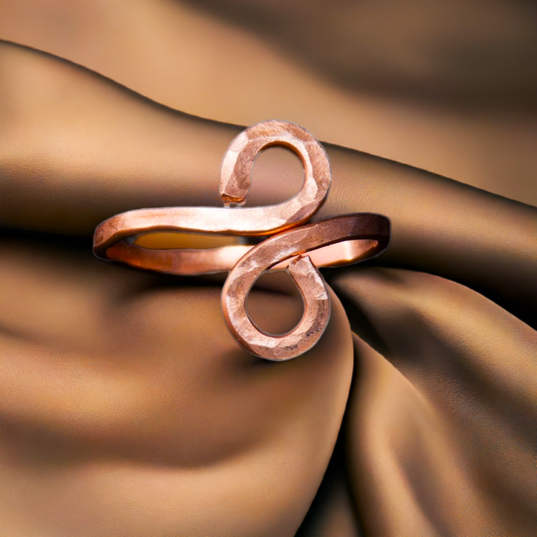 Copper Ring on satin background
