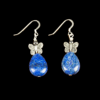 Blue lapis lazuli teardrop stone earrings. Each earring has a silver butterfly atop the teardrop shaped lapis lazuli stone. The earrings have French ear wires. These earrings are pictured on a black background.