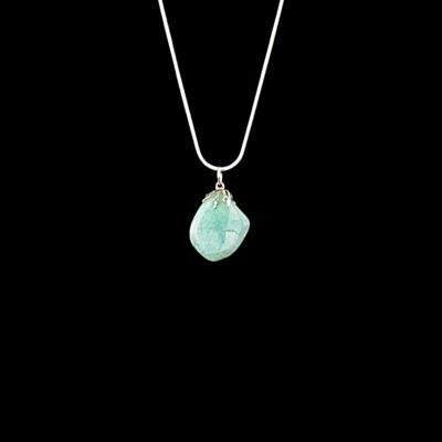 Greenish blue crackle quartz stone featuring a silver glue on bail. This pendant is shown on a silver chain.