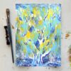 a glowing tree painted with white branches and trunk, yellow background and blue leaves