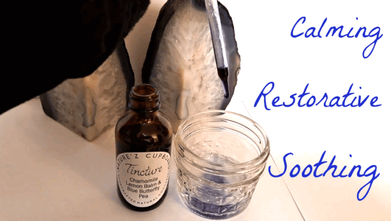 Amber tincture bottle labeled “Chamomile, Lemon Balm and Blue Butterfly Pea” next to a glass with purple liquid, set between two crystal geodes with the words “Calming,” “Restorative,” and “Soothing” written on the background.